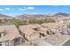 Expansive view of desert community featuring tan homes, native plants, and dramatic mountain views at 8096 E Lavender Dr, Gold Canyon, AZ 85118