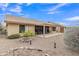 Home exterior with back patio and desert landscaping at 8096 E Lavender Dr, Gold Canyon, AZ 85118
