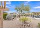 Desert backyard with xeriscape, mountain views, and covered patio at 8096 E Lavender Dr, Gold Canyon, AZ 85118