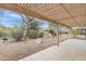 Backyard with pergola covered patio and desert landscaping at 8096 E Lavender Dr, Gold Canyon, AZ 85118