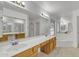 Bathroom featuring a dual sink vanity, large mirror, and a separate shower and bathtub at 8096 E Lavender Dr, Gold Canyon, AZ 85118
