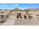 Charming single-story home with a two-car garage and xeriscaped front yard against a scenic mountain backdrop at 8096 E Lavender Dr, Gold Canyon, AZ 85118
