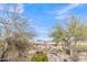 Desert home features desert landscaping, a backyard patio, and mountain views at 8096 E Lavender Dr, Gold Canyon, AZ 85118