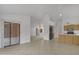 Open living space with tile flooring, patio access, and kitchen view at 8096 E Lavender Dr, Gold Canyon, AZ 85118