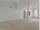 Expansive living room featuring neutral carpet and abundant natural light at 8096 E Lavender Dr, Gold Canyon, AZ 85118