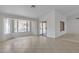 Spacious living room with large windows, tile flooring, and lots of natural light at 8096 E Lavender Dr, Gold Canyon, AZ 85118