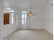 Living room with light neutral carpet, a chandelier, and natural light at 8096 E Lavender Dr, Gold Canyon, AZ 85118