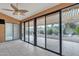 Spacious covered patio includes a ceiling fan, tile flooring, and backyard views at 8096 E Lavender Dr, Gold Canyon, AZ 85118