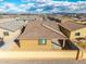 Birds eye view of a single Gathering residence with a tile roof in a residential neighborhood at 8552 S 258Th Dr, Buckeye, AZ 85326