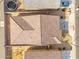Aerial view of tile roof, neighboring houses, and fenced backyard with trampoline at 8552 S 258Th Dr, Buckeye, AZ 85326