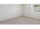 Light and airy bedroom with neutral walls and soft carpet flooring at 8552 S 258Th Dr, Buckeye, AZ 85326