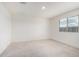 Bright bedroom with neutral carpet and a window allowing natural light at 8552 S 258Th Dr, Buckeye, AZ 85326