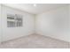 Neutral carpeted bedroom features a window with horizontal blinds at 8552 S 258Th Dr, Buckeye, AZ 85326