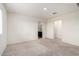 Carpeted bedroom with doors leading to a bathroom and closet at 8552 S 258Th Dr, Buckeye, AZ 85326