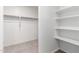 Walk-in closet featuring shelving for organizing clothes and accessories at 8552 S 258Th Dr, Buckeye, AZ 85326
