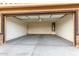 Spacious two-car garage featuring an updated water heater and interior access door at 8552 S 258Th Dr, Buckeye, AZ 85326