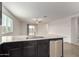 Modern kitchen features a stainless steel dishwasher and granite countertop at 8552 S 258Th Dr, Buckeye, AZ 85326