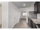 Well-lit kitchen transitions to a living space, with stainless steel appliances at 8552 S 258Th Dr, Buckeye, AZ 85326