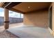 A covered outdoor patio offers shade and a comfortable space for relaxation and entertaining at 8552 S 258Th Dr, Buckeye, AZ 85326