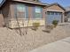 Charming home featuring a beautiful stone accent wall and meticulously xeriscaped landscaping in the front yard at , Maricopa, AZ 85138