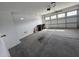 Spacious garage with ample room for parking and storage, featuring a multi-paneled door at , Maricopa, AZ 85138