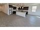 Spacious kitchen with a center island, stainless steel appliances, and tile flooring at , Maricopa, AZ 85138