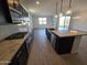 Modern kitchen showcasing sleek stainless steel appliances, granite countertops, and elegant dark wood cabinets at , Maricopa, AZ 85138