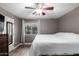 Relaxing bedroom with a view of the backyard through a bright window at 1135 E Desert Holly Dr, San Tan Valley, AZ 85143