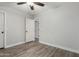 Bedroom with wood floors and neutral walls features an open doorway at 1135 E Desert Holly Dr, San Tan Valley, AZ 85143