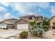 Charming two-story home featuring desert landscaping and a spacious two-car garage at 1135 E Desert Holly Dr, San Tan Valley, AZ 85143