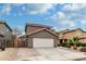 Attractive two-story home featuring a clean white garage door and desert landscaping at 1135 E Desert Holly Dr, San Tan Valley, AZ 85143