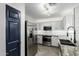 Modern kitchen featuring stainless steel appliances, white cabinets, and subway tile backsplash at 1135 E Desert Holly Dr, San Tan Valley, AZ 85143