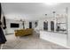 Open-concept living room featuring hardwood floors, modern lighting and comfortable seating at 1135 E Desert Holly Dr, San Tan Valley, AZ 85143