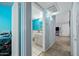 Hallway view of bath with a gray vanity and bright blue walls at 1180 E Belmont Ave, Phoenix, AZ 85020