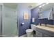 Bathroom featuring frosted glass shower, single vanity, and toilet at 1180 E Belmont Ave, Phoenix, AZ 85020
