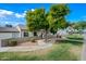 Charming home featuring lush landscaping, a private courtyard, and a welcoming walkway at 1180 E Belmont Ave, Phoenix, AZ 85020