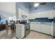 Bright kitchen featuring white cabinetry, stainless steel appliances, and a modern backsplash at 1180 E Belmont Ave, Phoenix, AZ 85020
