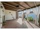 Patio with brick flooring, curtains, and a garden bed at 1180 E Belmont Ave, Phoenix, AZ 85020