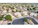 A high-angle aerial showcases the home's prime location in a beautiful, residential neighborhood at 1321 N Bronco Ct, Gilbert, AZ 85233