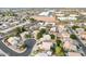 An aerial view of the neighborhood with mature landscaping and varied home styles, showcasing the community's appeal at 1321 N Bronco Ct, Gilbert, AZ 85233