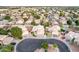 A high-angle aerial showcases the home's prime location in a beautiful, residential neighborhood at 1321 N Bronco Ct, Gilbert, AZ 85233
