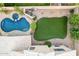 Aerial view showcasing a sparkling pool, lush landscaping, and grassy yard at 1321 N Bronco Ct, Gilbert, AZ 85233