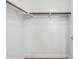 Walk-in closet with carpeted floors and a hanging rod for storage at 1321 N Bronco Ct, Gilbert, AZ 85233