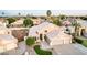 Stunning two-story home features a three-car garage, lovely landscaping, and a well-manicured lawn at 1321 N Bronco Ct, Gilbert, AZ 85233