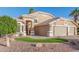 Charming single Gathering home with a well-manicured lawn and desert landscaping at 1321 N Bronco Ct, Gilbert, AZ 85233
