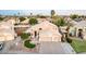 Stunning two-story home features a three-car garage, lovely landscaping, and a well-manicured lawn at 1321 N Bronco Ct, Gilbert, AZ 85233