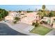 Beautiful two-story home featuring an attached three-car garage and appealing landscaping at 1321 N Bronco Ct, Gilbert, AZ 85233