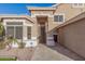 Inviting front door with security screen, desert landscaping, and custom pavers at 1321 N Bronco Ct, Gilbert, AZ 85233