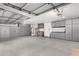 Spacious garage features epoxy floors, custom cabinets, and ample storage space at 1321 N Bronco Ct, Gilbert, AZ 85233