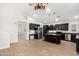 Open kitchen featuring dark cabinets, stainless appliances, and an island with seating at 1321 N Bronco Ct, Gilbert, AZ 85233